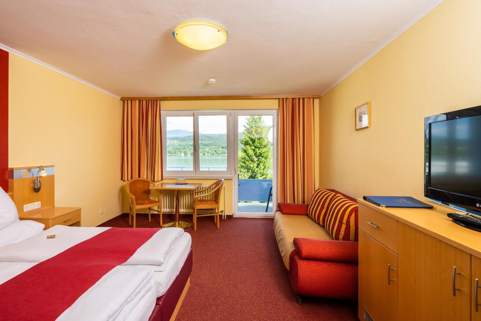 Strandhotel Schabus Фельден-ам-Вёртер-Зе Номер фото
